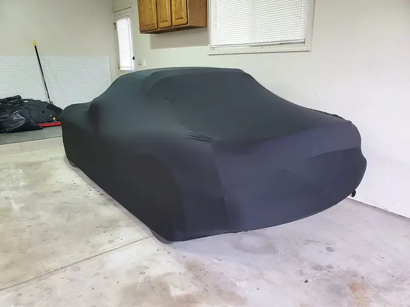 Customer photo: Mazda Miata NB under a stretch indoor cover in a garage