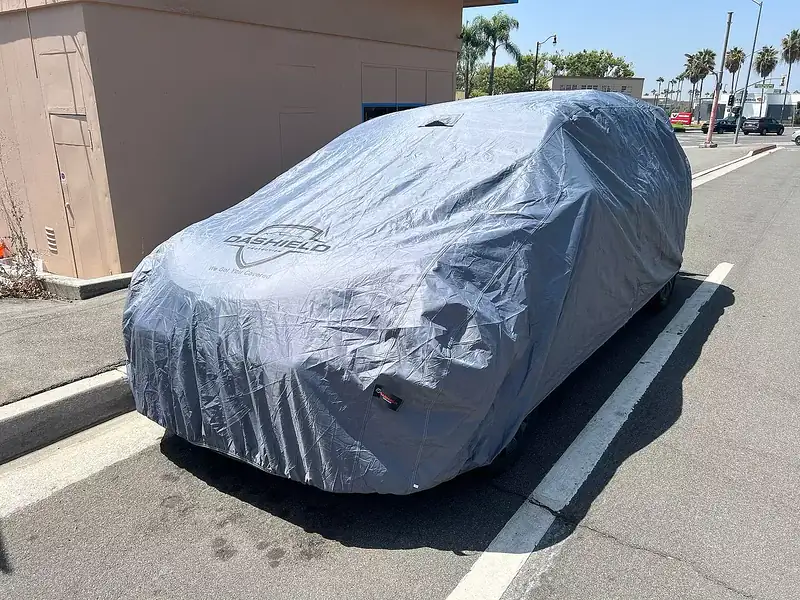 Customer photo: SUV under a DaShield cover in a sunny parking lot