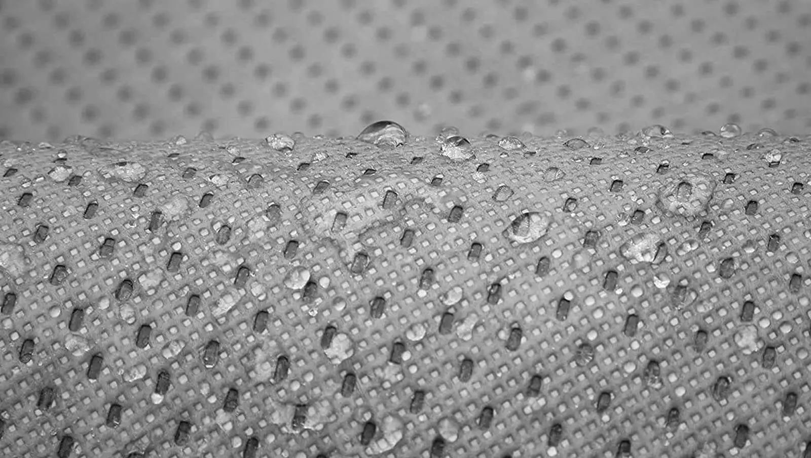 Macro of the WeatherTec UHD weave with water beading on the surface