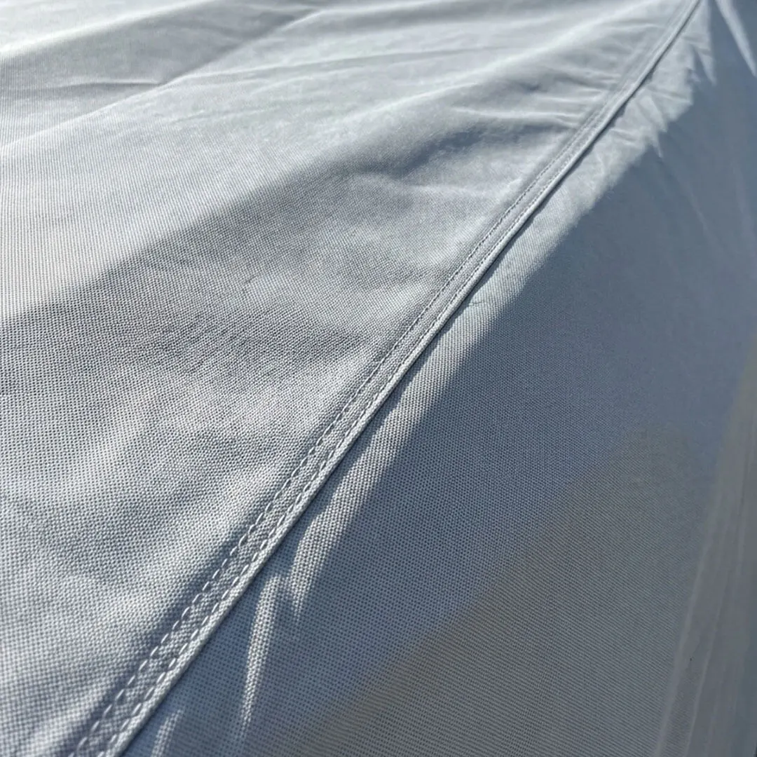 Close-up of the elastic hem and seam tucked under the body