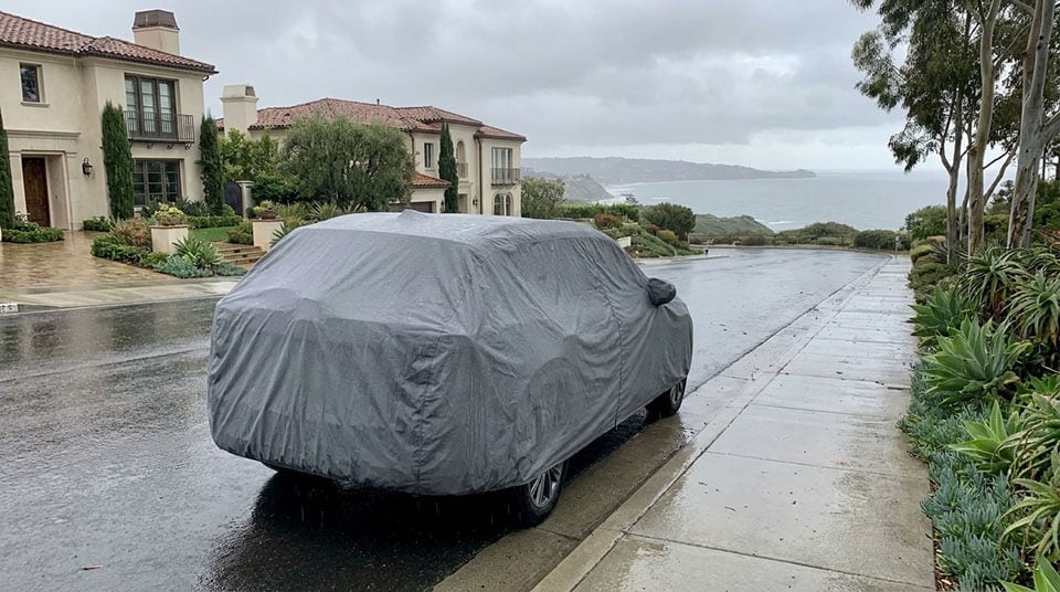 All-weather outdoor cover on a car through the seasons