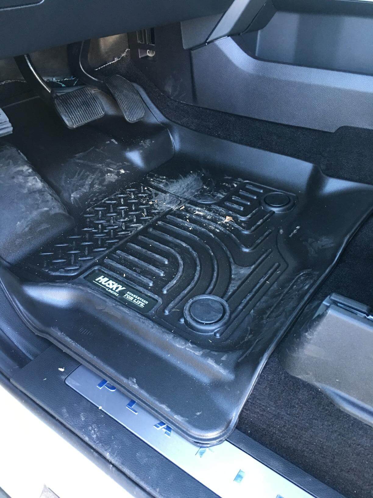 X-Act Contour mat with diamond-plate footpad in a truck