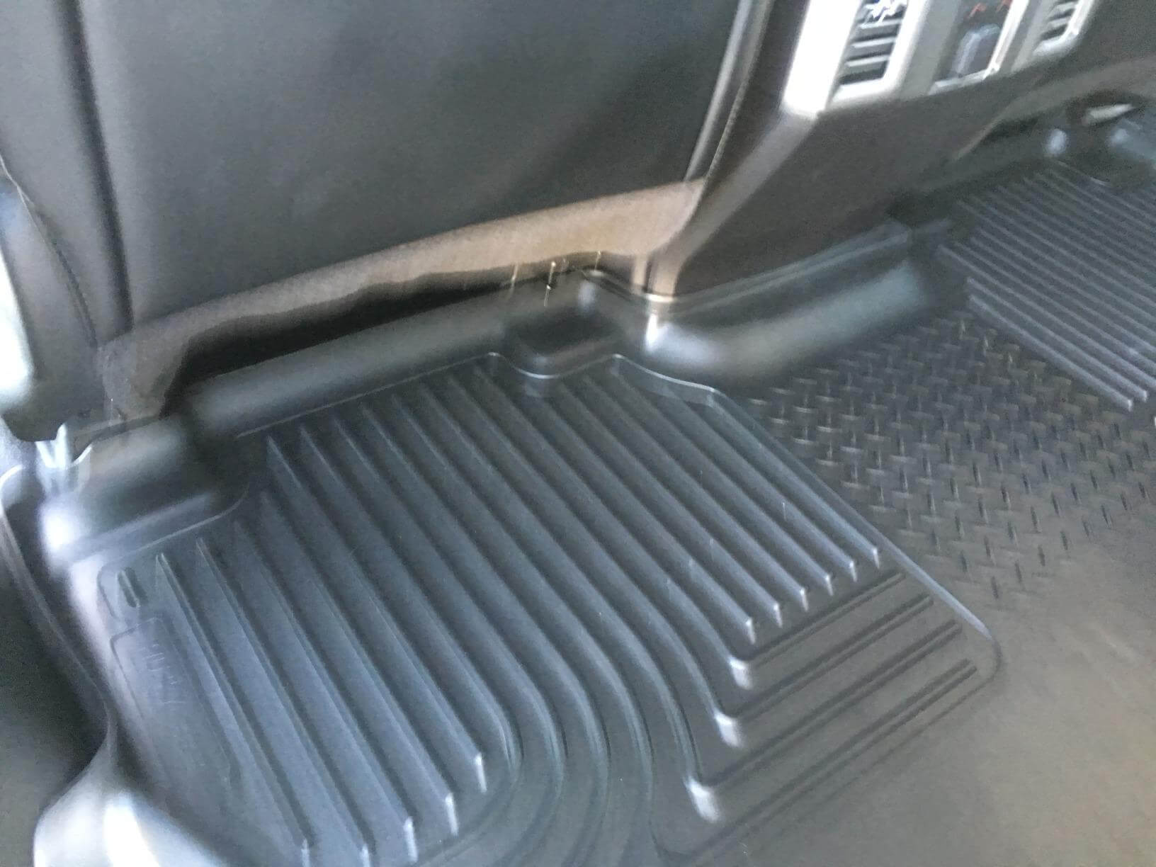 Husky Liners X-Act Contour mat installed in a Ford truck footwell