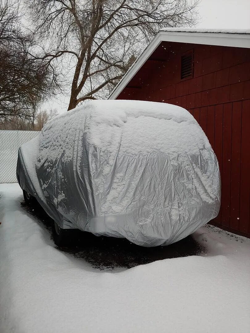 Customer photo: SUV protected from the elements by a cover