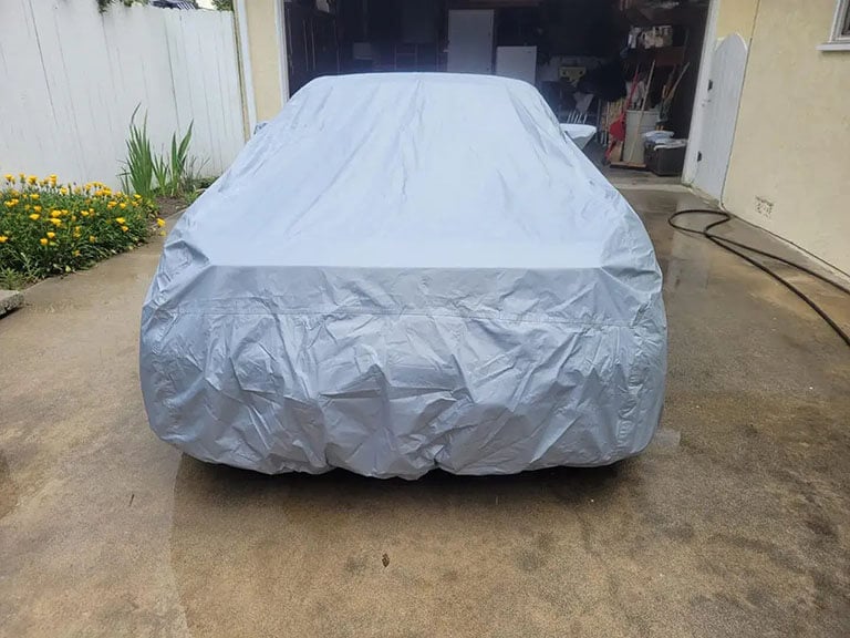 Tailored cover on an SUV parked street-side