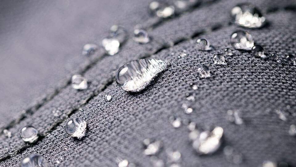 Heat-taped sealed seam on a waterproof car cover, blocking water from the stitch holes