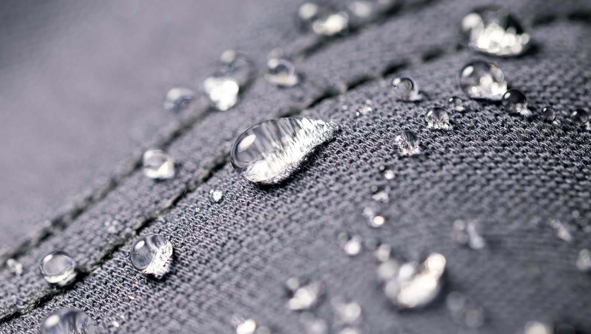 Macro close-up of DaShield Ultimum waterproof fabric with water droplets